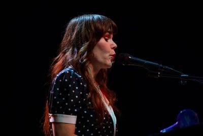 Rilo Kiley performing on stage
