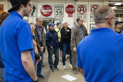 People learning how street signs are made