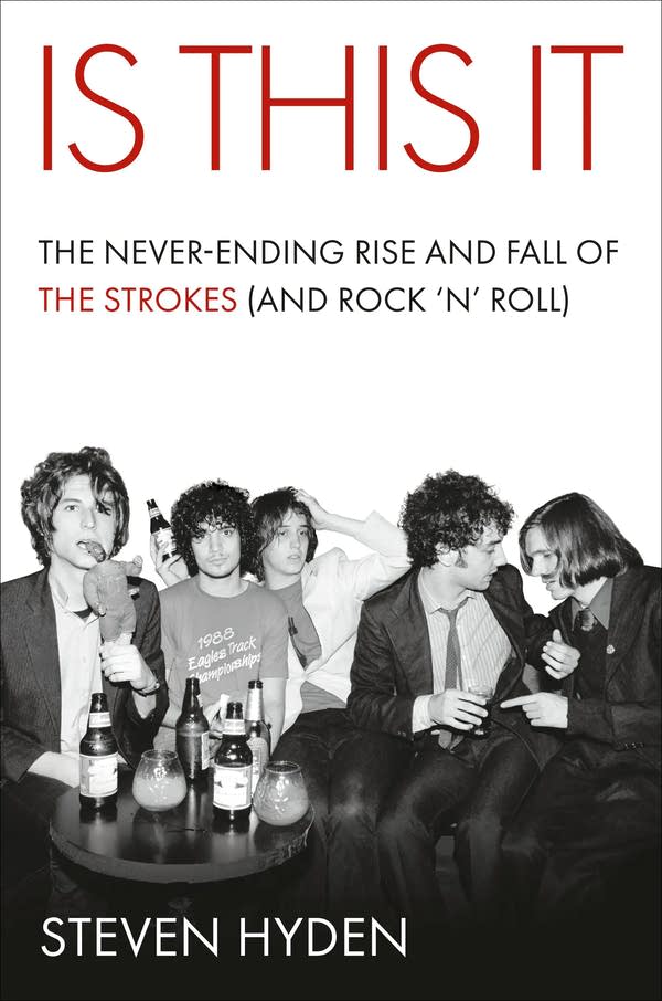 Five men sit together at a bar.