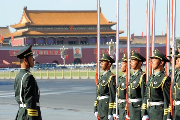 A Chinese paramilitary police stands guard