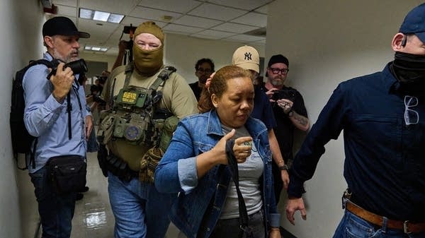 U.S. federal agents working for Immigration and Customs Enforcement detain immigrants and asylum seekers reporting for immigration court proceedings at the Jacob K. Javits Federal Building's U.S. Immigration Court in New York.
