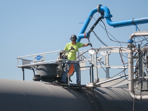A Highwater Ethanol plant employee works