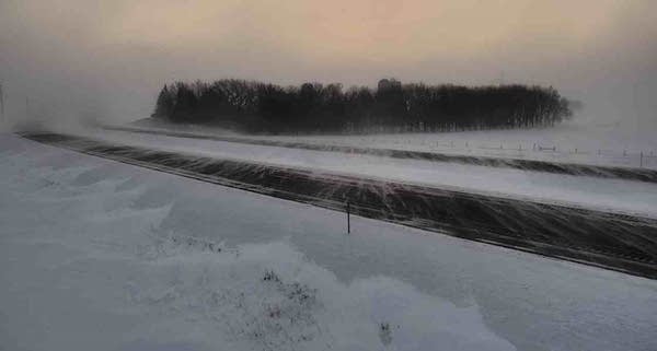 Snow drifts are seen across the roads.