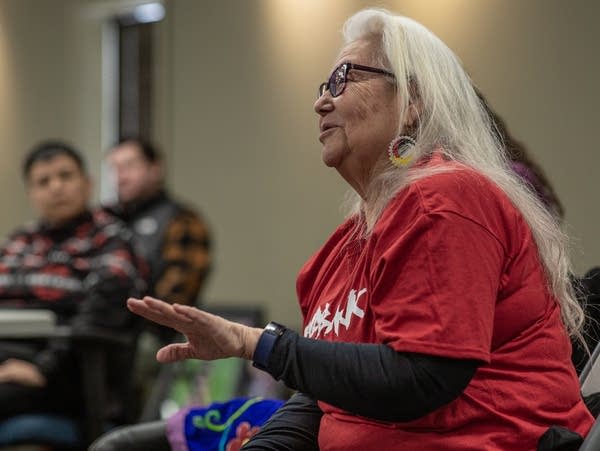 a woman speaks to a group