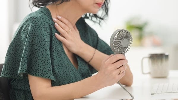 Menopausal symptoms such as hot flashes can affect how women perform in all sorts of work environments. 