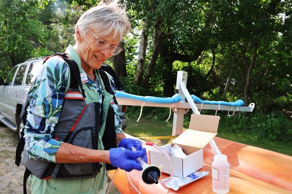 A woman prepares a filter