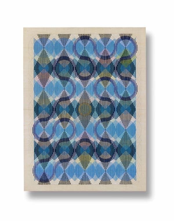 An art piece with colored thread