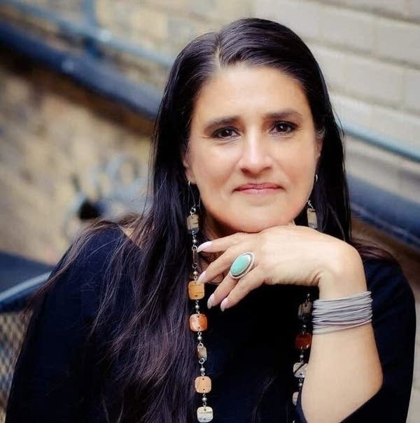A woman poses for a portrait
