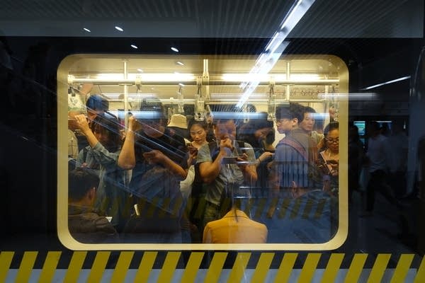 Workers in Shanghai say they feel squeezed by the rising cost of living. Credit: Charles Zhang/Marketplace