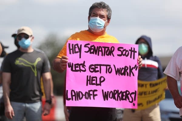 Jose Abreu join other demonstrators participating in a protest asking Senators to support the continuation of unemployment benefits on July 16, 2020 in Miami Springs, Florida.  