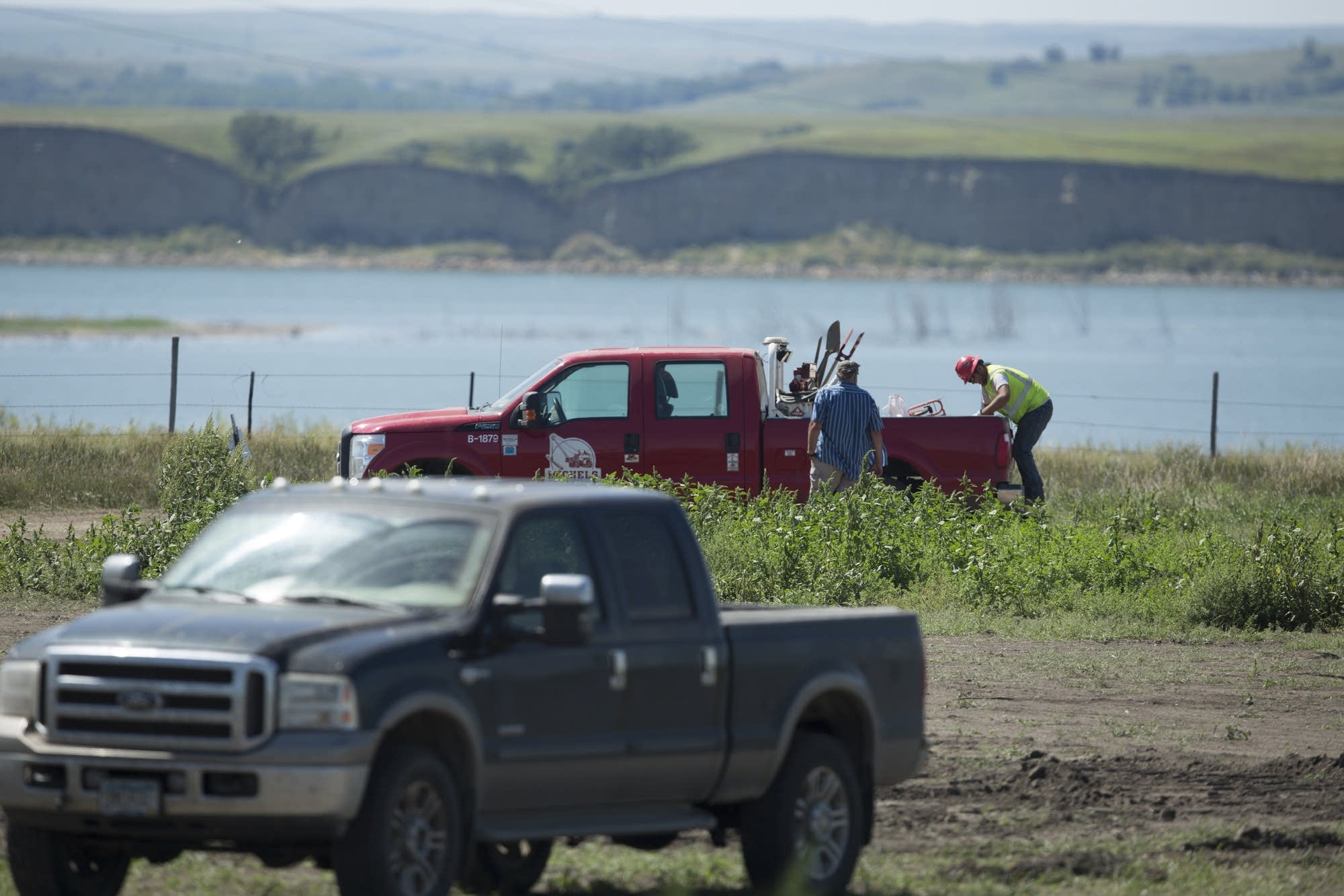 Construction workers prepare to continue work.