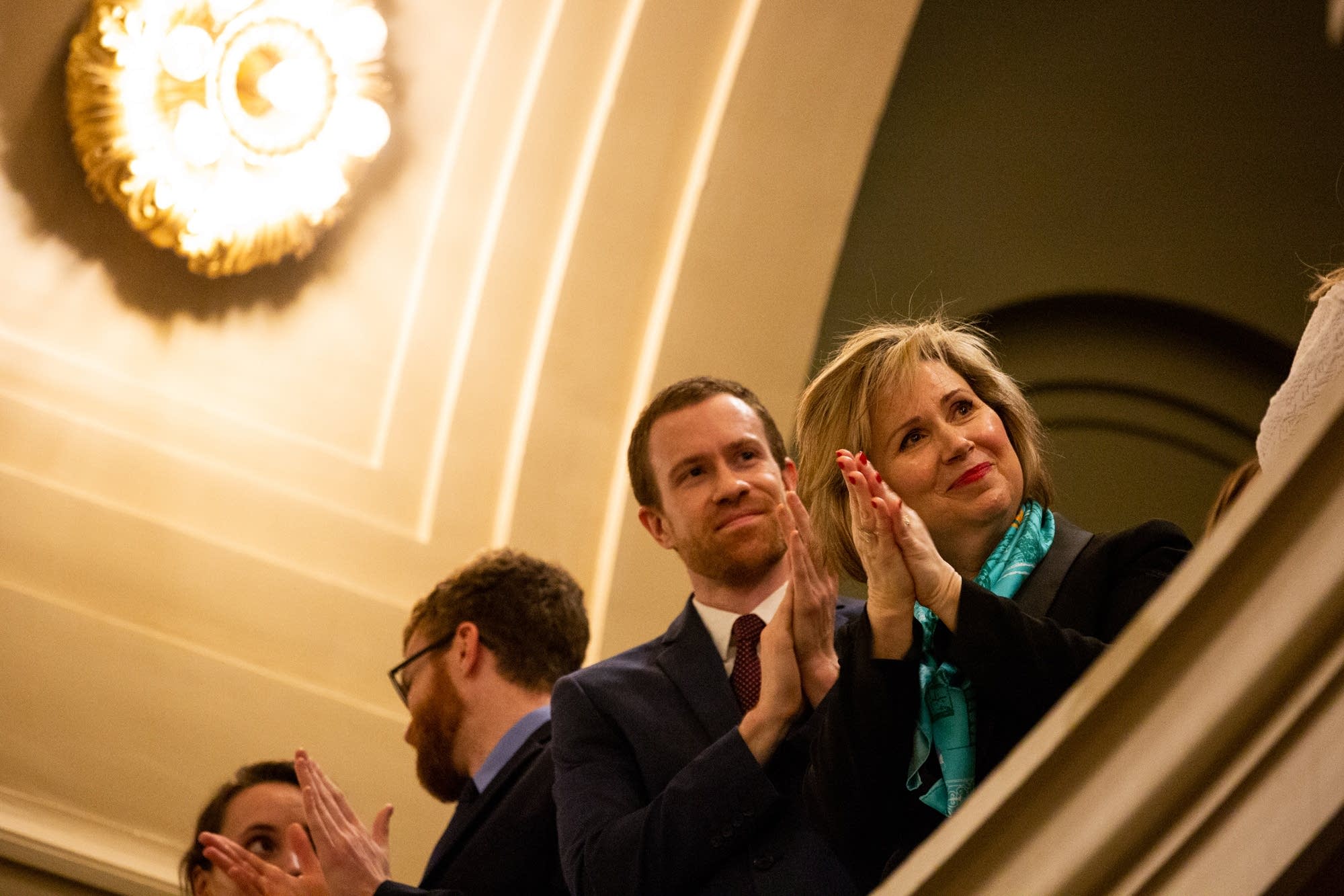 First Lady Gwen Walz claps during Gov. Tim Walz's State of the State.