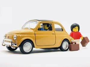 MIniature car and figurines.