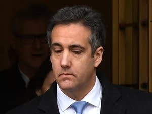 Michael Cohen leaves federal court.