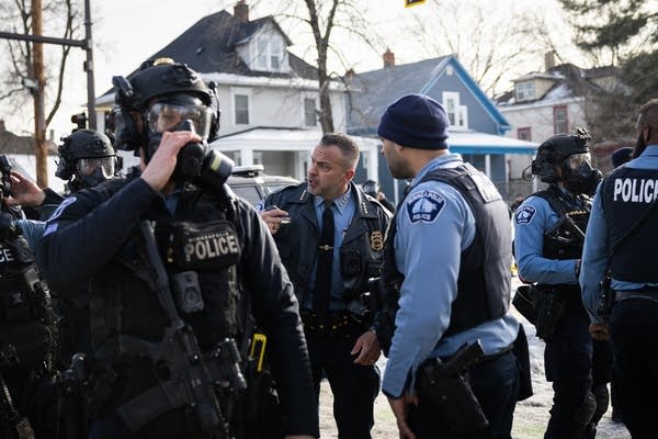 The chief speaks with officers