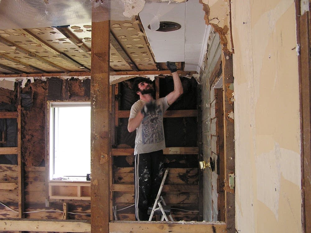 Ripping down ceiling tiles in Barnum