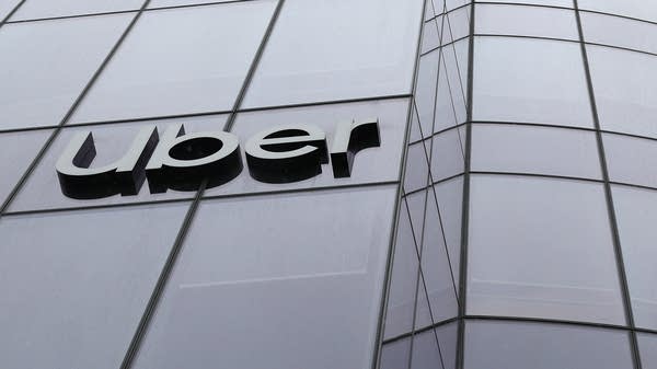 Uber's CEO said the company plans to broaden the scope of some managers and consolidate smaller teams.