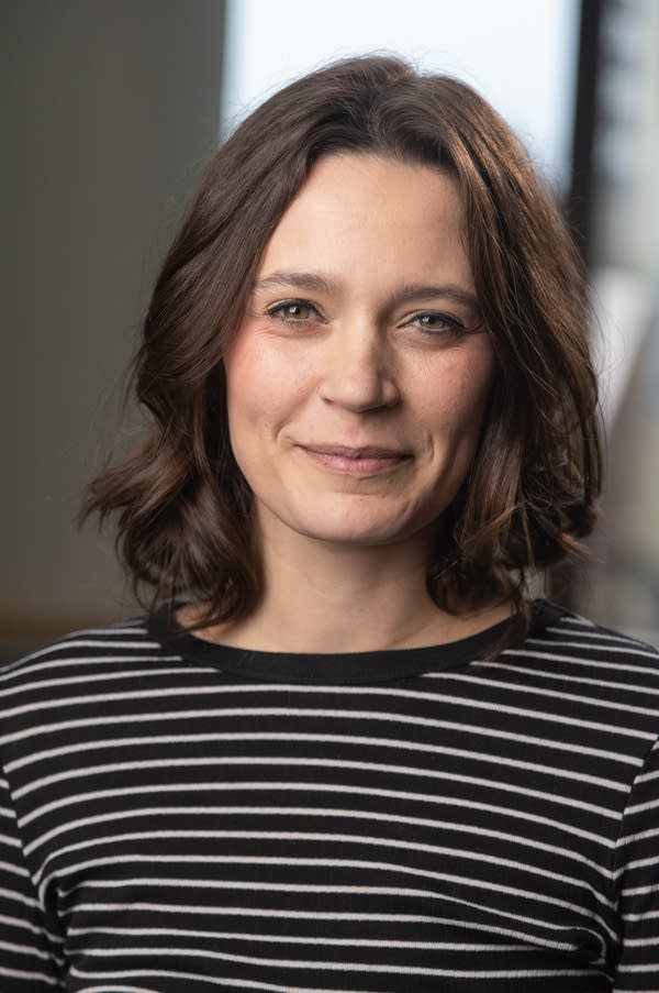 A woman smiles for a photo