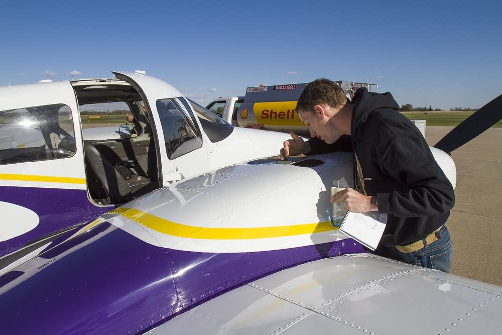 Aviation student Ethan Troe checked oil levels.