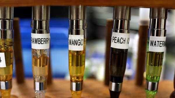 A variety of e-cigarette flavors are viewed for sale at Vape New York in 2013 in New York City.