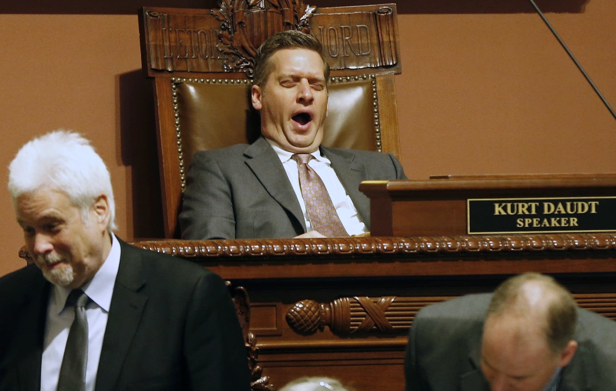 House Speaker Kurt Daudt yawns as he waits for the roll call.