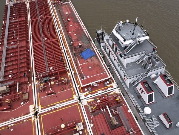 Two die when helicopter crashes into a barge in the Mississippi River near Illinois