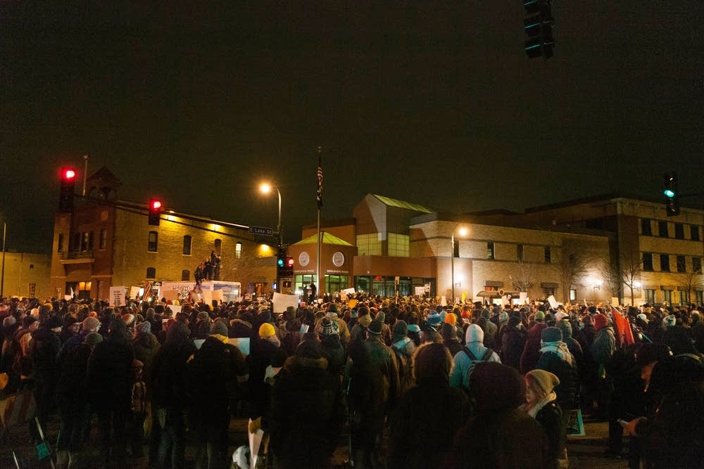 Outside the Third Precinct police station