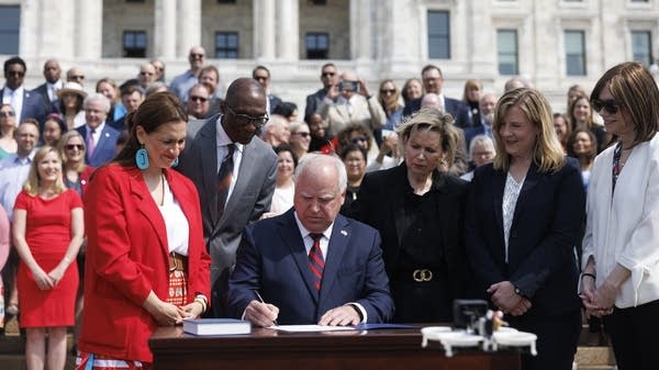 A person signs the bill