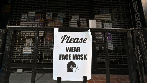 The persistently elevated level of layoffs are occurring as a spike in virus cases has forced six states to reverse their move to reopen businesses.