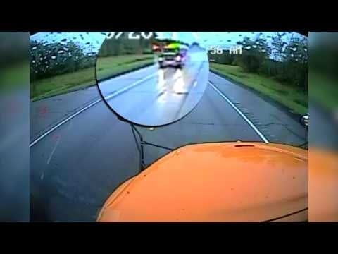 Video: Truck ignores stopped school bus, misses kids