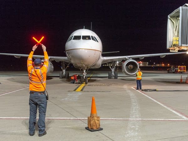 The flight carrying the remains of Dante Tini arrives at Duluth Airport