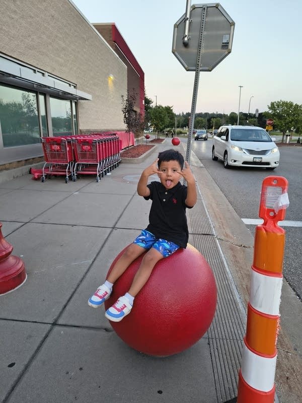 A young boy poses for a photo-1