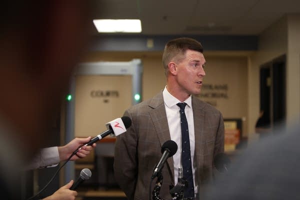 A man talks to the press