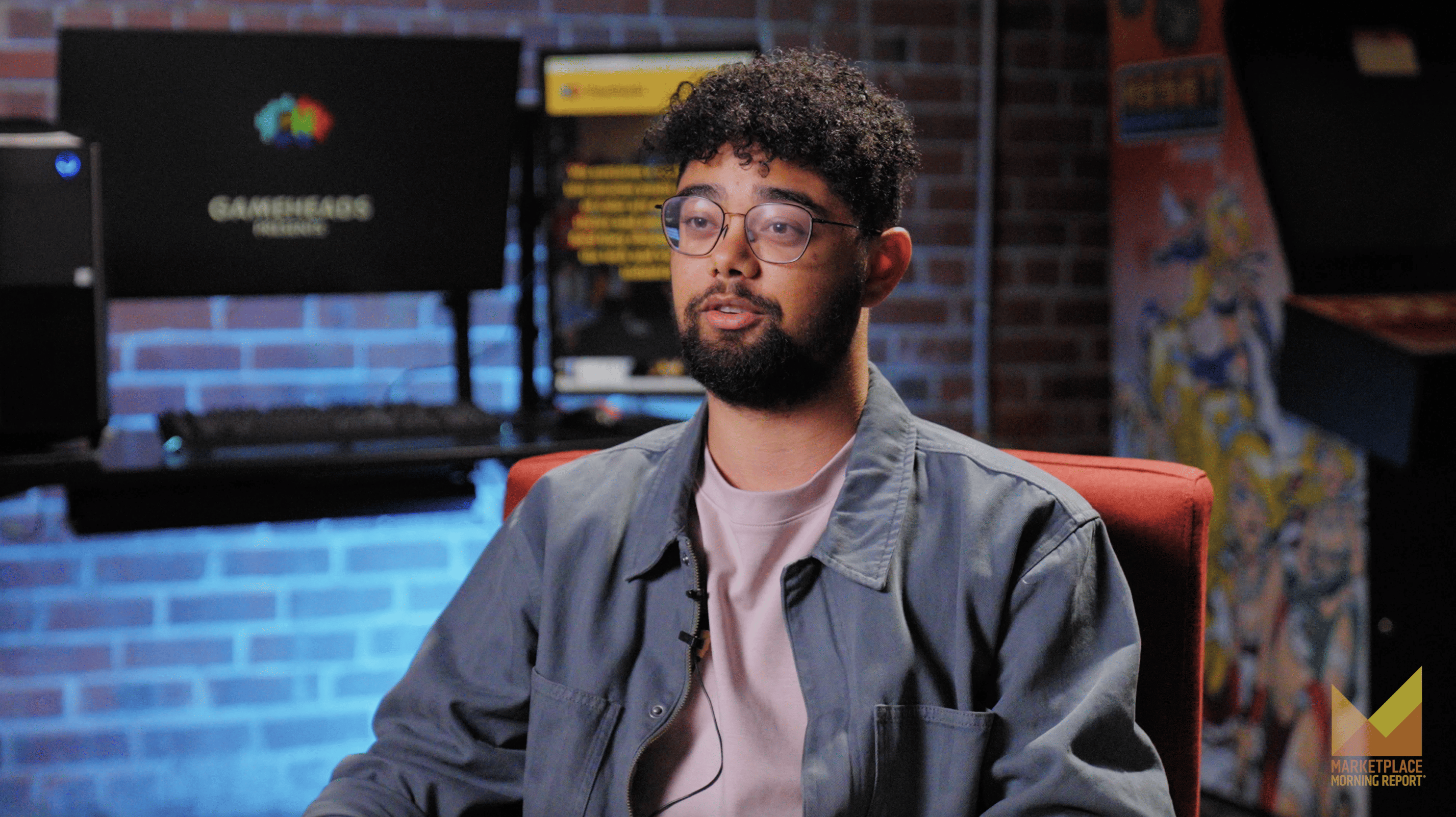 Trevor Cardoza sits in the Gameheads work space