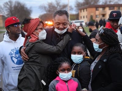 The Rev. Jesse Jackson meets with demonstrators