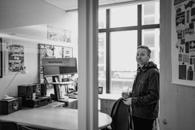 Reed Fischer stands in his office.