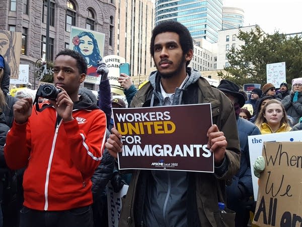 Protesters listen to Jaylani Hussein.