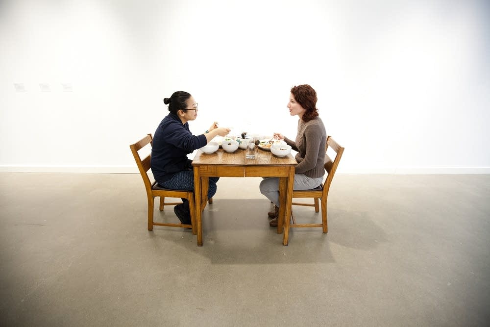 Strangers dining -- as art.