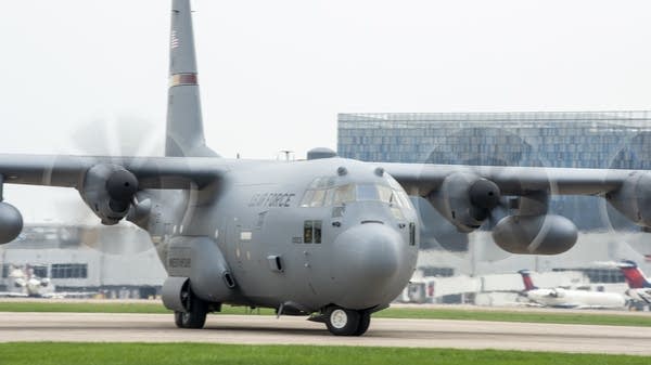 A military plane taxis to a parking spot