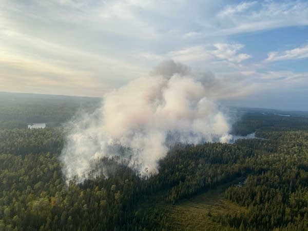 Smoke rises from a wildfire