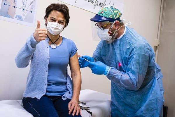 The OECD says its global economic outlook has markedly improved in recent months due to vaccine rollout and relief programs.