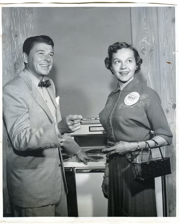 A black and white image of a woman and Ronald Reagan