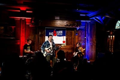 A band performing together in a music venue 