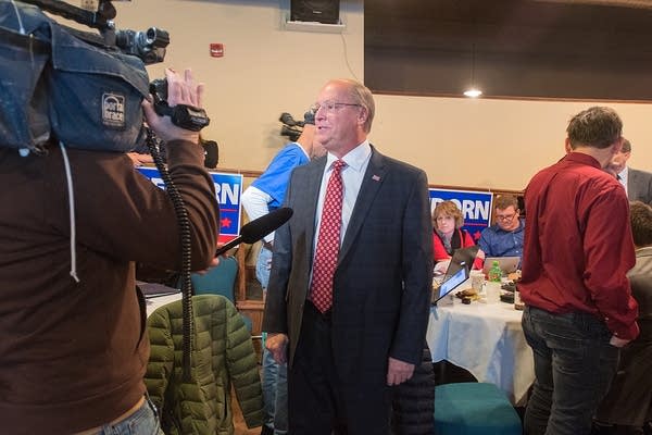 Jim Hagedorn speaks to a television reporter at the election party.