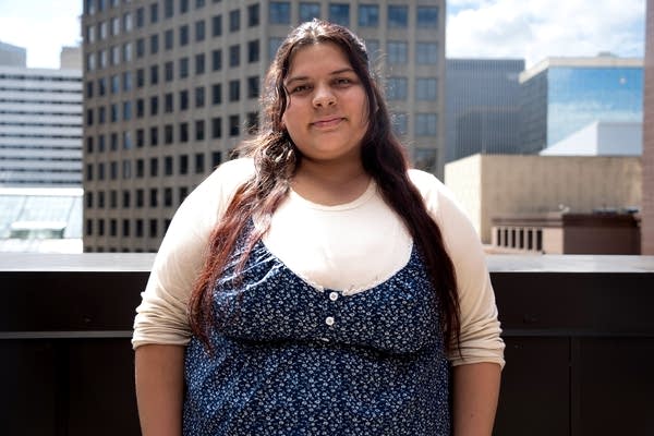 a young woman poses for a portrait