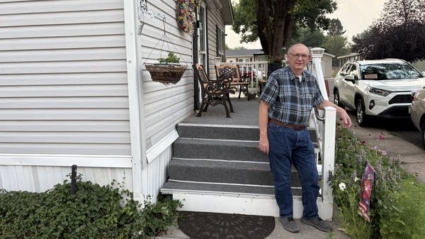 Tim Fritch poses for a photo in front of his Sunset Park home in Loveland. He is hosting a committee meeting for residents who want to purchase the park themselves.