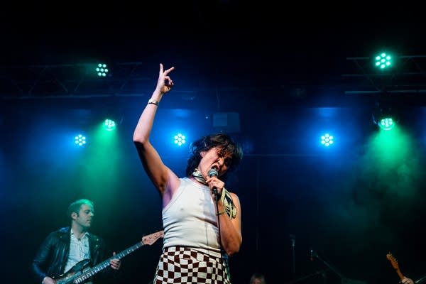 Two musicians performing onstage
