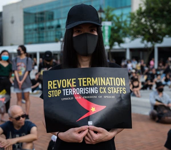 CENTRAL, HONG KONG, HONG KONG ISLAND, CHINA - 2019/08/28: A protester holds a placards criticising the treatment of Cathay Pacific employees by the company during the demonstration.
Anti-government protesters rallied in support of aviation workers that had been let go due to their political views and participation in various anti-extradition demonstrations. Various leaders gave speeches before the demonstrators marched to Pacific Place and created a 'Lennon Wall'. (Photo by Aidan Marzo/SOPA Images/LightRocket via Getty Images)