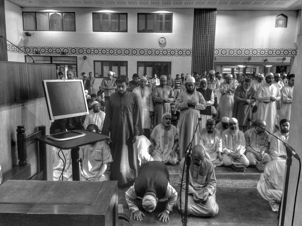 The congregation waits for Imam