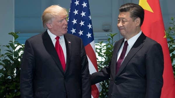U.S. President Donald Trump and Chinese President Xi Jinping pose before a sideline meeting at the 2017 G-20 summit in Hamburg, Germany. 


